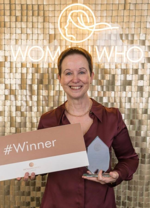 woman who award pic edit2 An image of Carol receiving the Woman Who Solopreneur special award 2025